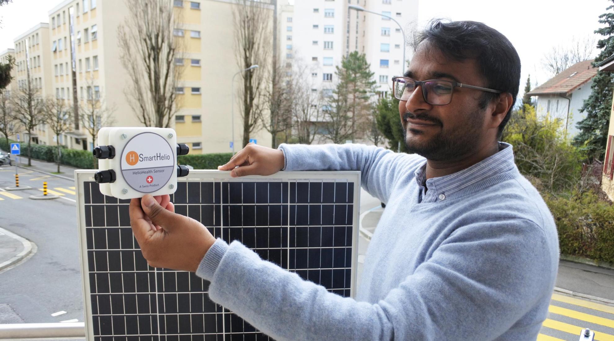 SmartHelio founder with a prototype of the IoT sensor
