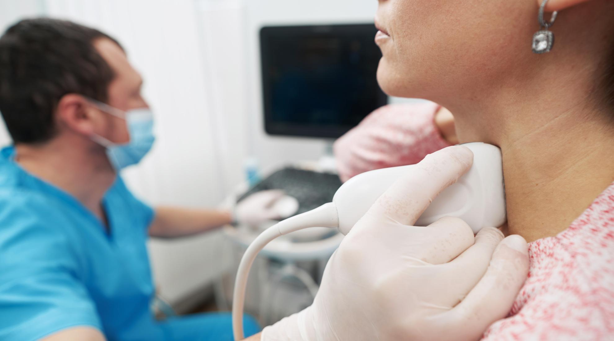 young woman undergoing an examination of thyroid